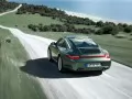 обои для рабочего стола: «Porsche 911 Tagra 4 мчится по дороге»