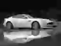Aston Martin Vanquish S and splashes from under wheels
