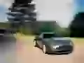 grey-silvery Aston Martin V8. Speed