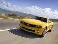 Yellow Chevrolet Camaro flies on road