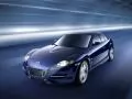 выбранное изображение: «Тёмно-синяя тюнингованная Mazda»