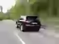 Black Porsche Cayenne rushes on road