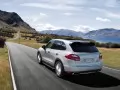 open picture: «Silvery Porsche Cayenne rushes on road»