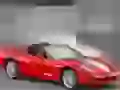 Red Chevrolet Corvette with open top