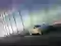 Aston Martin DB9 rushes on the bridge