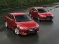 обои для рабочего стола: «Две красные Mitsubishi Lancer Evolution X»