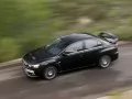 open picture: «Mitsubishi Lancer Evolution X flies on road, a photo from above»
