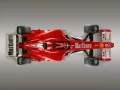 выбранное изображение: «Красная гоночная Ferrari F2004 на сером фоне, вид сверху»