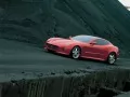 выбранное изображение: «Красная Ferrari на фоне чёрный скал»