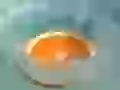 an Orange falling in water