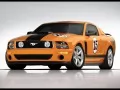 обои для рабочего стола: «Жёлто-оранжевый тюнингованый Ford Mustang Saleen Parnelli Jones LE»
