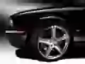 The Left wing and a wheel black Jaguar Super-V8-Portfolio
