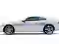 Silvery Jaguar Xk on a white background
