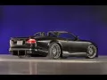 выбранное изображение: «Чёрный Jaguar Xk на сиреневом фоне»