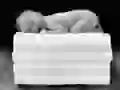 Sleeping baby on a pile towels