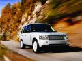 White Land Rover Range-Rover on mountain road