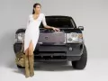 Black Land Rover Range-Rover and the girl in a white dress