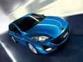 обои для рабочего стола: «Синяя Mazda 3 мчится по дороге»