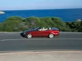 current picture: «Red Mercedes Clk-320-Cdi on road along sea coast»