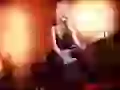Avril Lavigne with a guitar at a concert