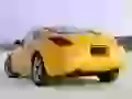 Yellow Nissan 35th-Anniversary-Z on a beach, the rear view