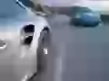 Two Porsche 911 Turbo on highway