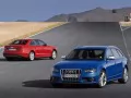 Audi S4. Red and dark blue cars on road