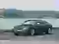 Audi S5 rushes along lake
