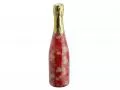 Bottle of champagne with candies