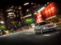 обои для рабочего стола: «Subaru Legacy мчится по ночному мегаполису»