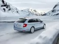 open picture: «Skoda Superb Combi 4x4 rushes on snow-covered road»