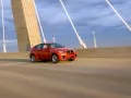 обои для рабочего стола: «Оранжевая BMW X6 M мчится по мосту»