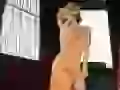 Christina Milian in an orange dress
