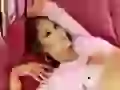 Jennifer Lopez on pink bed
