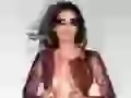 Rebecca Romijn in dark glasses and open clothes